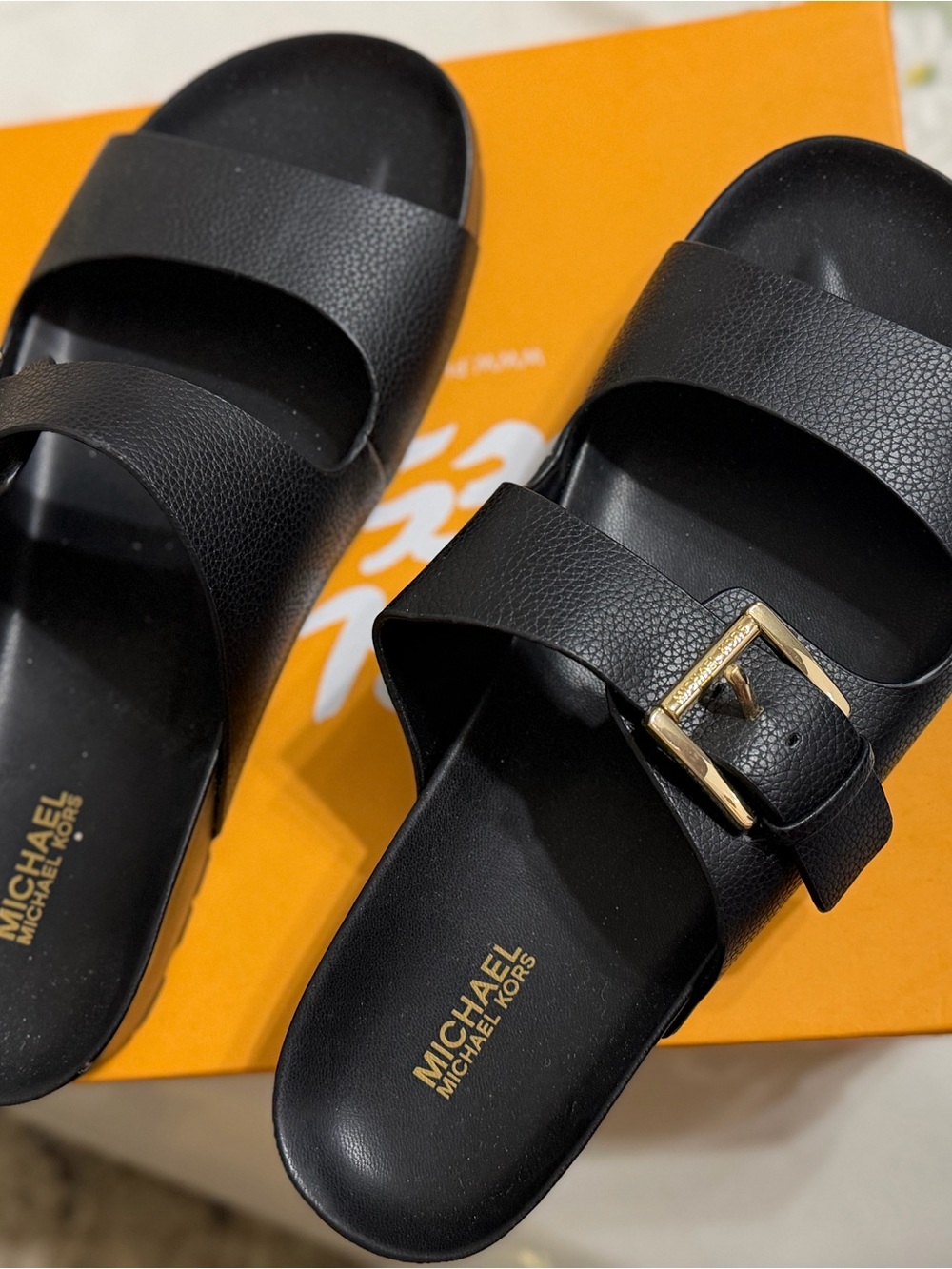 Michael Kors Black Slide Sandals with Gold Buckle Accent